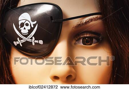 Stock Image - Shop-window mannequin wearing an eye patch, symbolic image for the Pirate Party of Germany. Fotosearch