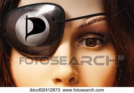 Stock Image - Shop-window mannequin wearing an eye patch, symbolic image for the Pirate Party of Germany. Fotosearch