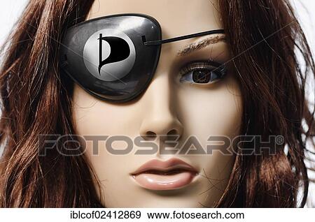 Shop-window mannequin wearing an eye patch with the logo of the Pirate Party of Germany View Large Photo Image Stock Photo - Shop-window mannequin wearing an eye patch with the logo of the Pirate Party of Germany. Fotosearch