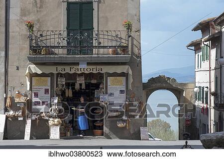 Stock Image - "Shop with local specialties, in the back gate and lake, Piazza Mazzini, old town, Castiglione del Lago, Umbria, Italy, Europe". Fotosearch