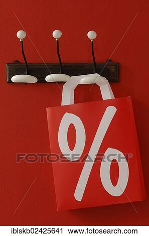 Shopping bag with a per cent sign hanging on nostalgic coat hooks View Large Photo Image Stock Image - Shopping bag with a per cent sign hanging on nostalgic coat hooks. Fotosearch