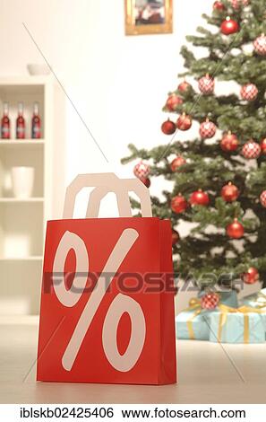 Shopping bag with a percent sign in a festive Christmas environment View Large Photo Image Stock Photograph - Shopping bag with a percent sign in a festive Christmas environment. Fotosearch