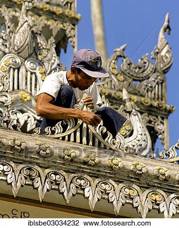 "Shwedagon Pagoda, worker restoring the wooden ornaments, Rangun, Yangon Region, Myanmar, Burma, Asia" View Large Photo Image Stock Image - "Shwedagon Pagoda, worker restoring the wooden ornaments, Rangun, Yangon Region, Myanmar, Burma, Asia". Fotosearch