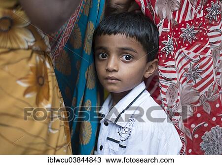 "Shy Indian boy hiding between women, Hyderabad, Andhra Pradesh, India, Asia" View Large Photo Image Stock Image - "Shy Indian boy hiding between women, Hyderabad, Andhra Pradesh, India, Asia". Fotosearch