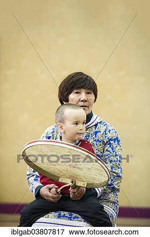 "Siberian Yupiks, woman holding a drum, Nova Chaplina, Chukotka, Russia, Europe" View Large Photo Image Stock Photo - "Siberian Yupiks, woman holding a drum, Nova Chaplina, Chukotka, Russia, Europe". Fotosearch