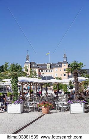 "Sidewalk cafe and Schloss Schwetzingen Castle, Schwetzingen, Baden-Wurttemberg, Germany, Europe" View Large Photo Image Stock Photo - "Sidewalk cafe and Schloss Schwetzingen Castle, Schwetzingen, Baden-Wurttemberg, Germany, Europe". Fotosearch