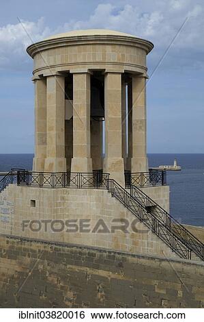 "Siege Bell Monument commemorating people who lost their lives in World War II, Valletta, Malta, Europe" View Large Photo Image Stock Photograph - "Siege Bell Monument commemorating people who lost their lives in World War II, Valletta, Malta, Europe". Fotosearch