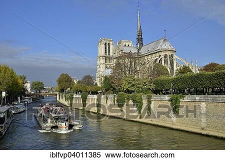 "Sightseeing boat on the Seine river in front of Notre Dame Cathedral, Paris, France, Europe" View Large Photo Image Stock Photography - "Sightseeing boat on the Seine river in front of Notre Dame Cathedral, Paris, France, Europe". Fotosearch