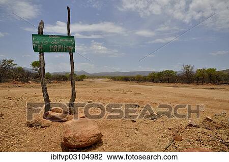 "Sign at the entrance to the village of Omuramba, residential village of Chief Hikuminue Kapika, the tribal leader of the Namibian Himba people, Omuramba, Kaokoland, Kunene, Namibia, Africa" View Large Photo Image Stock Image - "Sign at the entrance to the village of Omuramba, residential village of Chief Hikuminue Kapika, the tribal leader of the Namibian Himba people, Omuramba, Kaokoland, Kunene, Namibia, Africa". Fotosearch