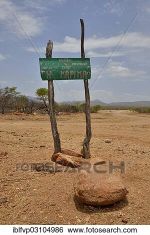 "Sign at the entrance to the village of Omuramba, residential village of Chief Hikuminue Kapika, the tribal leader of the Namibian Himba people, Omuramba, Kaokoland, Kunene, Namibia, Africa" View Large Photo Image Stock Photograph - "Sign at the entrance to the village of Omuramba, residential village of Chief Hikuminue Kapika, the tribal leader of the Namibian Himba people, Omuramba, Kaokoland, Kunene, Namibia, Africa". Fotosearch