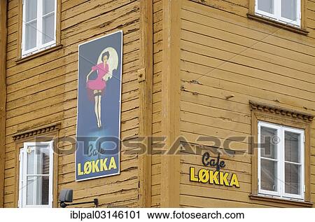 Stock Image - "Sign, """"Cafe Lokka"""", on the facade of a yellow wooden house in the historic town centre, Bakklandet, Trondheim, Norway, Europe". Fotosearch