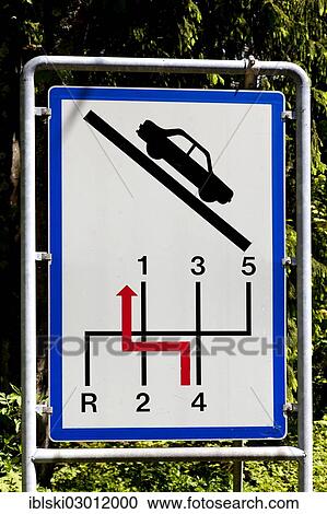 "Sign for motorists to switch back a gear, drive slowly on steep slopes, on Wurzen Pass near Villach, Carinthia, Austria, Europe" View Large Photo Image Stock Image - "Sign for motorists to switch back a gear, drive slowly on steep slopes, on Wurzen Pass near Villach, Carinthia, Austria, Europe". Fotosearch