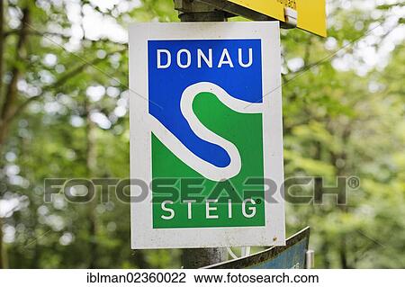 Stock Image - "Sign for the Donausteig hiking trail along the Danube River, Hausruckviertel region, Upper Austria, Austria, Europe". Fotosearch