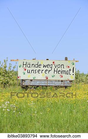 Picture - "Sign """"Hande weg von unserer Heimat"""", German for """"Hands off our home"""", Holzweilerhof farm near Grossbottwar, Baden-Wurttemberg, Germany, Europe". Fotosearch