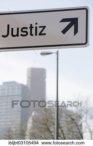 Picture - "Sign, """"Justiz"""", German for Justice, with an arrow pointing up, Cologne, Rhineland, North Rhine-Westphalia, Germany, Europe". Fotosearch