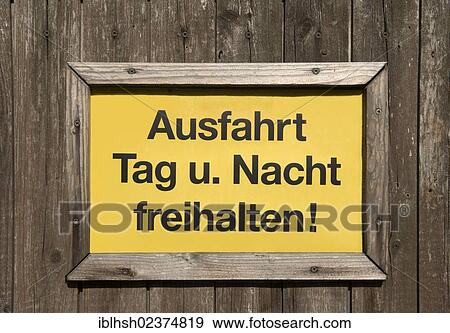 "Sign, lettering """"Ausfahrt Tag und Nacht freihalten! """", German for """"Keep clear day and night! """" on a wooden gate, Germany, PublicGround, Europe" View Large Photo Image Stock Photo - "Sign, lettering """"Ausfahrt Tag und Nacht freihalten! """", German for """"Keep clear day and night! """" on a wooden gate, Germany, PublicGround, Europe". Fotosearch