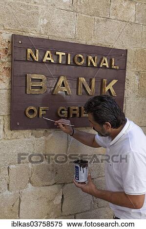 "Sign """"National Bank of Greece"""", man painting the sign, new town, Rhodes, Rhodos Island, Dodecanese, Greece, Europe" View Large Photo Image Stock Photography - "Sign """"National Bank of Greece"""", man painting the sign, new town, Rhodes, Rhodos Island, Dodecanese, Greece, Europe". Fotosearch