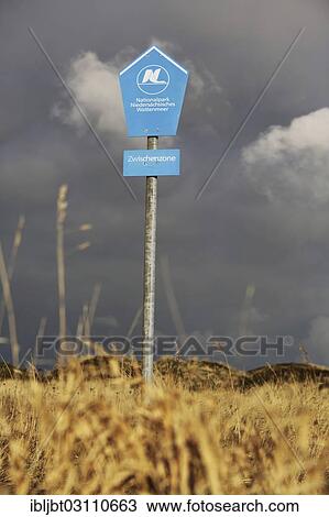 "Sign, """"Nationalpark Niedersaechsisches Wattenmeer"""", Wadden Sea National Park of Lower Saxony, Langeoog, Ostfriesische Inseln, Lower Saxony, Germany, Europe" View Large Photo Image Stock Image - "Sign, """"Nationalpark Niedersaechsisches Wattenmeer"""", Wadden Sea National Park of Lower Saxony, Langeoog, Ostfriesische Inseln, Lower Saxony, Germany, Europe". Fotosearch