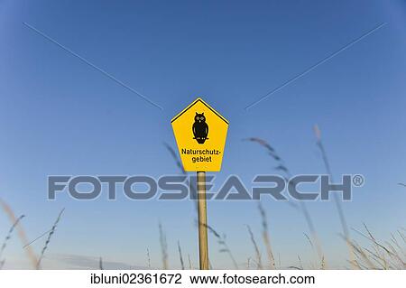Stock Image - "Sign, Naturschutzgebiet, German for nature reserve at the Schleimuende Bird Sanctuary, Schleswig-Holstein, Germany, Europe". Fotosearch