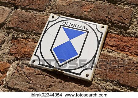 Picture - "Sign on a house, lettering """"Denkmal"""", German for """"heritage-protected building"""", Wismar, Mecklenburg-Western Pomerania, Germany, Europe". Fotosearch