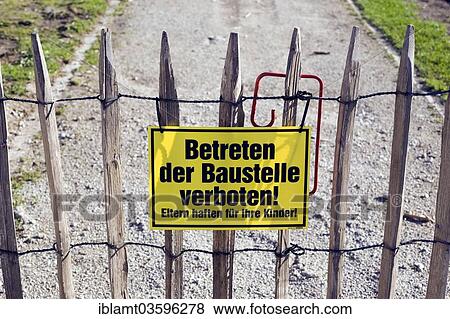 "Sign on a picket fence """"Betreten der Baustelle verboten! """", German for """"Entering the building site is forbidden"""", Obermenzing, Munich, Upper Bavaria, Bavaria, Germany, Europe" View Large Photo Image Stock Photo - "Sign on a picket fence """"Betreten der Baustelle verboten! """", German for """"Entering the building site is forbidden"""", Obermenzing, Munich, Upper Bavaria, Bavaria, Germany, Europe". Fotosearch