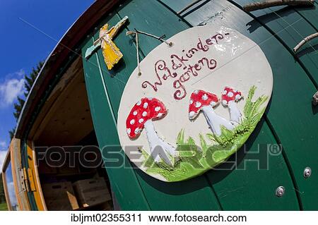 "Sign on the door of the trailer which is used for playing and as a shelter in the forest kindergarten, Ilmmuenster, Bavaria, Germany, Europe" View Large Photo Image Stock Image - "Sign on the door of the trailer which is used for playing and as a shelter in the forest kindergarten, Ilmmuenster, Bavaria, Germany, Europe". Fotosearch