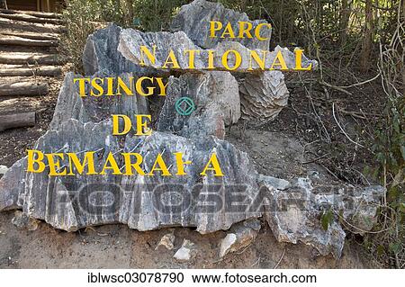 Stock Image - "Sign """"Parc National Tsingy de Bemaraha"""", Tsingy de Bemaraha National Park, at the entrance to the Big Tsingy de Bemaraha limestone formations, UNESCO World Heritage Site, Tsingy de Bemaraha National Park, Melaky Region, Madagascar, Africa". Fotosearch