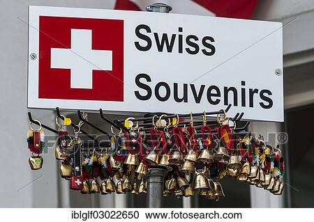 "Sign """"Swiss Souvenirs"""" and typical Swiss souvenirs, small cowbells, Solothurn, Sankt Gallen, Canton of Solothurn, Switzerland, Europe" View Large Photo Image Stock Image - "Sign """"Swiss Souvenirs"""" and typical Swiss souvenirs, small cowbells, Solothurn, Sankt Gallen, Canton of Solothurn, Switzerland, Europe". Fotosearch