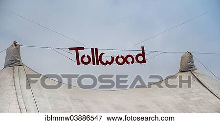 "Sign """"Tollwood"""" above a tent roof, Munich, Upper Bavaria, Bavaria, Germany, Europe" View Large Photo Image Stock Photo - "Sign """"Tollwood"""" above a tent roof, Munich, Upper Bavaria, Bavaria, Germany, Europe". Fotosearch