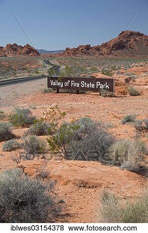 Stock Photo - "Sign """"Valley of Fire State Park"""", with its characteristic red sandstone formations, Valley of Fire State Park, Overton, Nevada, United States, North America". Fotosearch