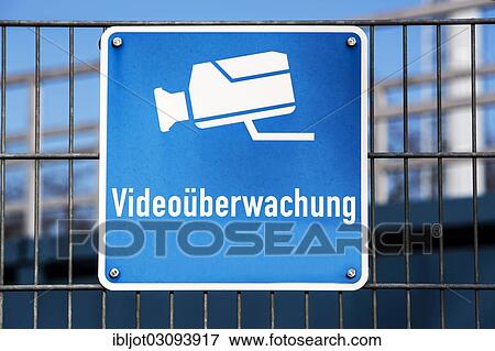 "Sign, """"Videoueberwachung"""", German for """"video surveillance"""" on the fence of an industrial company, Germany, Europe" View Large Photo Image Stock Photo - "Sign, """"Videoueberwachung"""", German for """"video surveillance"""" on the fence of an industrial company, Germany, Europe". Fotosearch