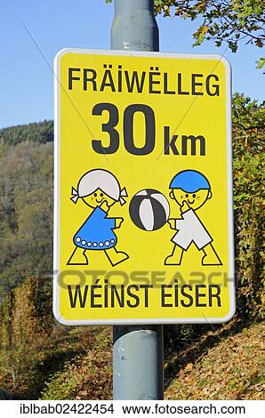 Sign, voluntarily 30 km, take care of children playing, drive slowly, in the language of Luxembourgish, Luxembourg, Europe, PublicGround, Europe View Large Photo Image Picture - Sign, voluntarily 30 km, take care of children playing, drive slowly, in the language of Luxembourgish, Luxembourg, Europe, PublicGround, Europe. Fotosearch