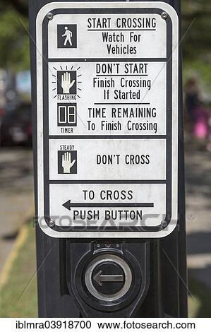 Stock Image - "Sign with instructions for a pedestrian crossing, Savannah, Georgia, United States, North America". Fotosearch