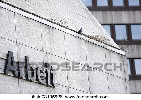"Signage """"Arbeit"""", on the building of the Agentur fuer Arbeit, German for Employment Agency, Cologne, Rhineland, North Rhine-Westphalia, Germany, Europe" View Large Photo Image Stock Photograph - "Signage """"Arbeit"""", on the building of the Agentur fuer Arbeit, German for Employment Agency, Cologne, Rhineland, North Rhine-Westphalia, Germany, Europe". Fotosearch