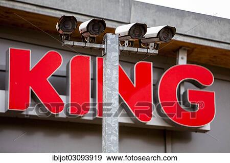 "Signage, """"King"""" with video surveillance cameras in the parking lot of a roadhouse, Dortmund, Ruhr district, North Rhine-Westphalia, Germany, Europe" View Large Photo Image Stock Photo - "Signage, """"King"""" with video surveillance cameras in the parking lot of a roadhouse, Dortmund, Ruhr district, North Rhine-Westphalia, Germany, Europe". Fotosearch