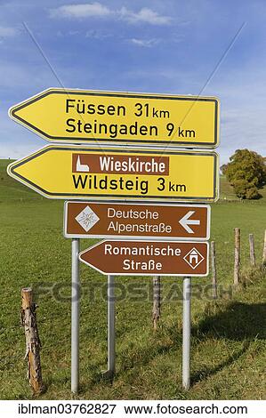 "Signpost, Deutsche Alpenstrasse or German Alpine Road, and Romantische Strasse or Romantic Road scenic routes, Rottenbuch, Pfaffenwinkel region, Upper Bavaria, Bavaria, Germany, Europe" View Large Photo Image Stock Photo - "Signpost, Deutsche Alpenstrasse or German Alpine Road, and Romantische Strasse or Romantic Road scenic routes, Rottenbuch, Pfaffenwinkel region, Upper Bavaria, Bavaria, Germany, Europe". Fotosearch