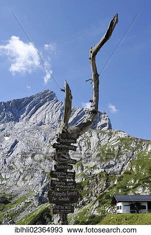 Stock Image - "Signpost for hikers, Mt Alpspitze, Wetterstein range, Garmisch-Partenkirchen, Upper Bavaria, Bavaria, Germany, Europe". Fotosearch