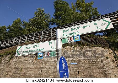 Signpost for walkers and cyclists on the Rhine river, near the Rheinfelden power station, Rheinfelden - Baden, Baden-Wuerttemberg, Germany, Europe View Large Photo Image Picture - Signpost for walkers and cyclists on the Rhine river, near the Rheinfelden power station, Rheinfelden - Baden, Baden-Wuerttemberg, Germany, Europe. Fotosearch