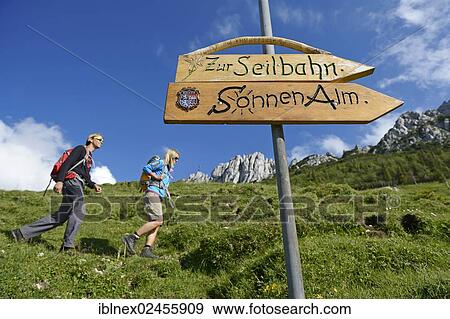 "Signpost, hikers in front of Kampenwand Mountain, Chiemgau, Bavaria, Germany, Europe" View Large Photo Image Stock Photo - "Signpost, hikers in front of Kampenwand Mountain, Chiemgau, Bavaria, Germany, Europe". Fotosearch