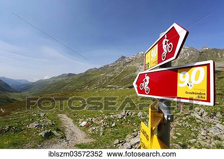 Stock Image - "Signpost showing a bike route in Gletschtaelli, Dischma Valley, Davos, Graubunden, Switzerland, Europe". Fotosearch