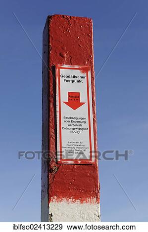 Stock Photo - Signpost with a sign for a geodetic benchmark, Cape Arkona, Ruegen Island, Mecklenburg-Western Pomerania, Germany, Europe. Fotosearch
