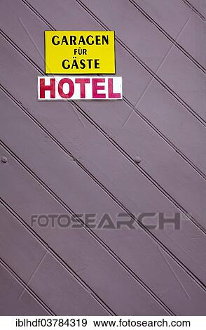 "Signs on garage door of a hotel, parking only for guests, Germany, Europe" View Large Photo Image Stock Photo - "Signs on garage door of a hotel, parking only for guests, Germany, Europe". Fotosearch