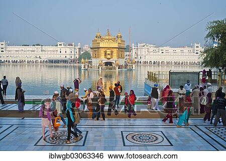 "Sikh pilgrims walking around the Amrit Sagar or Holy Lake, Harmandir Sahib or Hari Mandir or Golden Temple, the most important Sikh temple, at the back, Amritsar, Punjab, India, Asia" View Large Photo Image Stock Photograph - "Sikh pilgrims walking around the Amrit Sagar or Holy Lake, Harmandir Sahib or Hari Mandir or Golden Temple, the most important Sikh temple, at the back, Amritsar, Punjab, India, Asia". Fotosearch