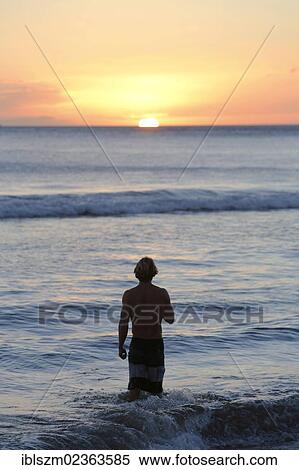 Stock Photography - "Silhouette of a man against the sunset, Kaanapali, Maui, Hawaii, USA, America". Fotosearch