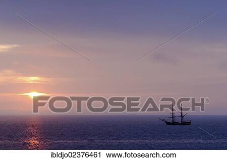 "Silhouette of a sailing boat against sunrise, near Port-Haliguen on the east side of the Quiberon peninsula, southern Brittany, Bretagne, France, Europe" View Large Photo Image Stock Image - "Silhouette of a sailing boat against sunrise, near Port-Haliguen on the east side of the Quiberon peninsula, southern Brittany, Bretagne, France, Europe". Fotosearch