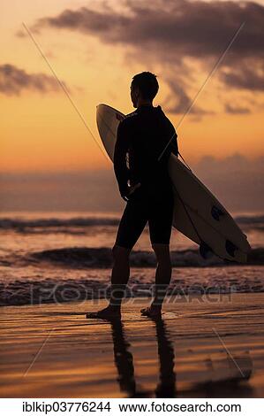 "Silhouette of a surfer watching the sunset, Sanur Beach, Bali, Indonesia, Asia" View Large Photo Image Picture - "Silhouette of a surfer watching the sunset, Sanur Beach, Bali, Indonesia, Asia". Fotosearch