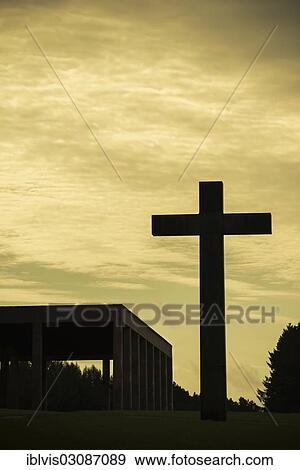 "Silhouette of big Christian cross and Chapel of the Holy Cross, Skogskyrkogarden cemetery, Stockholm, Sweden, Europe" View Large Photo Image Stock Photo - "Silhouette of big Christian cross and Chapel of the Holy Cross, Skogskyrkogarden cemetery, Stockholm, Sweden, Europe". Fotosearch
