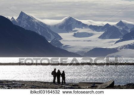 "Silhouettes of expedition participants in front of the mountain and glacier scenery of Smeerenburgbreen, Smeerenburgfjorden, Spitsbergen Island, Svalbard Archipelago, Svalbard and Jan Mayen, Norway, Europe" View Large Photo Image Stock Image - "Silhouettes of expedition participants in front of the mountain and glacier scenery of Smeerenburgbreen, Smeerenburgfjorden, Spitsbergen Island, Svalbard Archipelago, Svalbard and Jan Mayen, Norway, Europe". Fotosearch