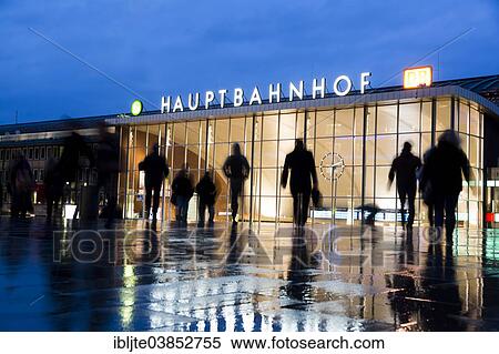 Stock Photography - "Silhouettes of people at dusk in front of the Cologne Central Railway Station or Hauptbahnhof, Cologne, North Rhine-Westphalia, Germany, Europe". Fotosearch