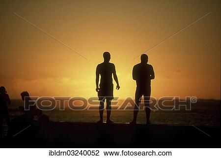 "Silhouettes of people on the beach at sunset, St. Denis, La Reunion, Reunion, France, Africa" View Large Photo Image Stock Image - "Silhouettes of people on the beach at sunset, St. Denis, La Reunion, Reunion, France, Africa". Fotosearch